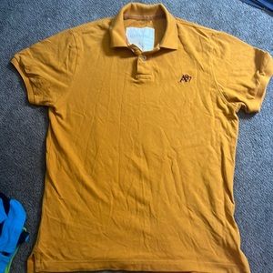 Aeropostale mustard polo t-shirt with maroon logo.